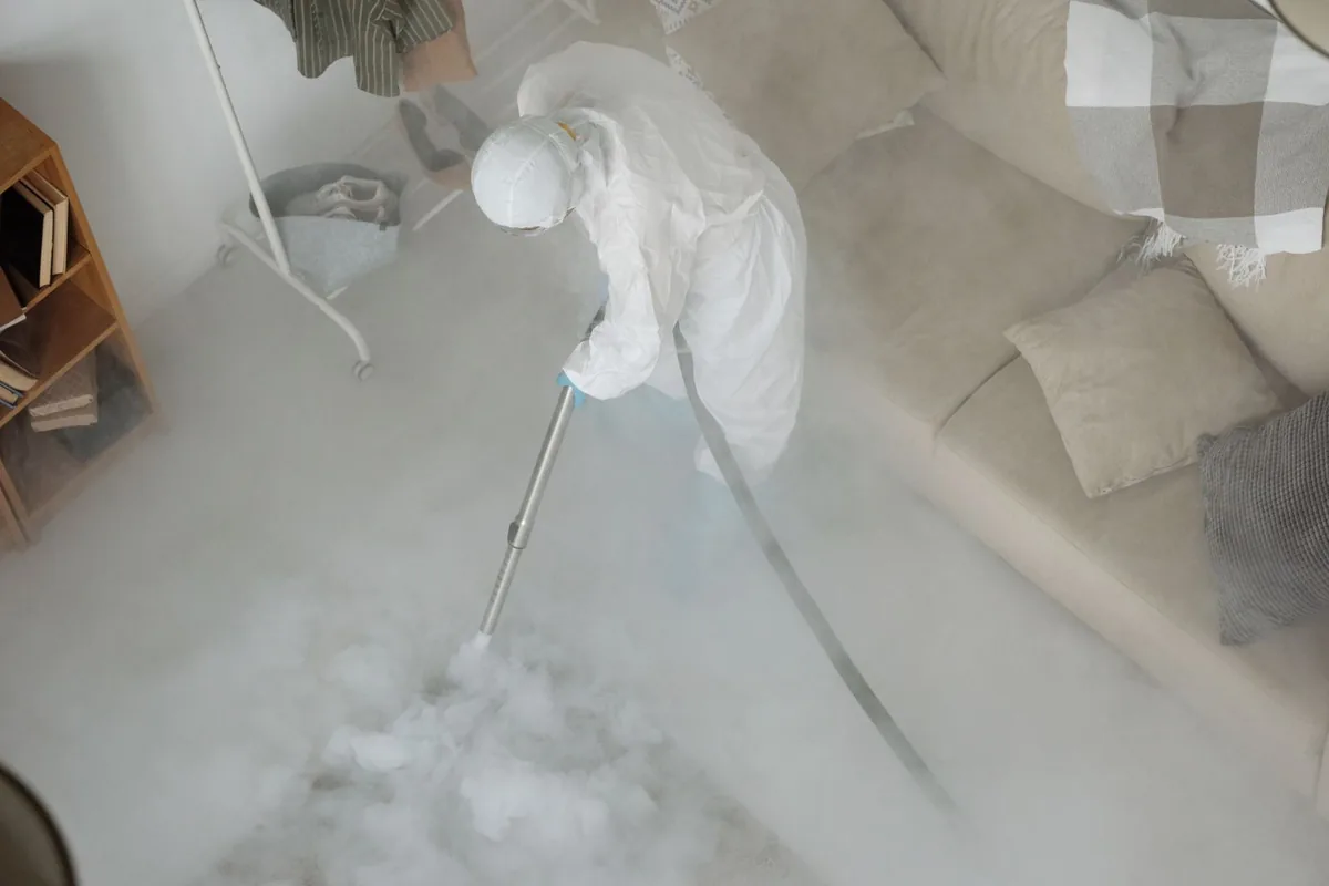 Biohazard cleanup technician in protective equipment, Holladay, UT
